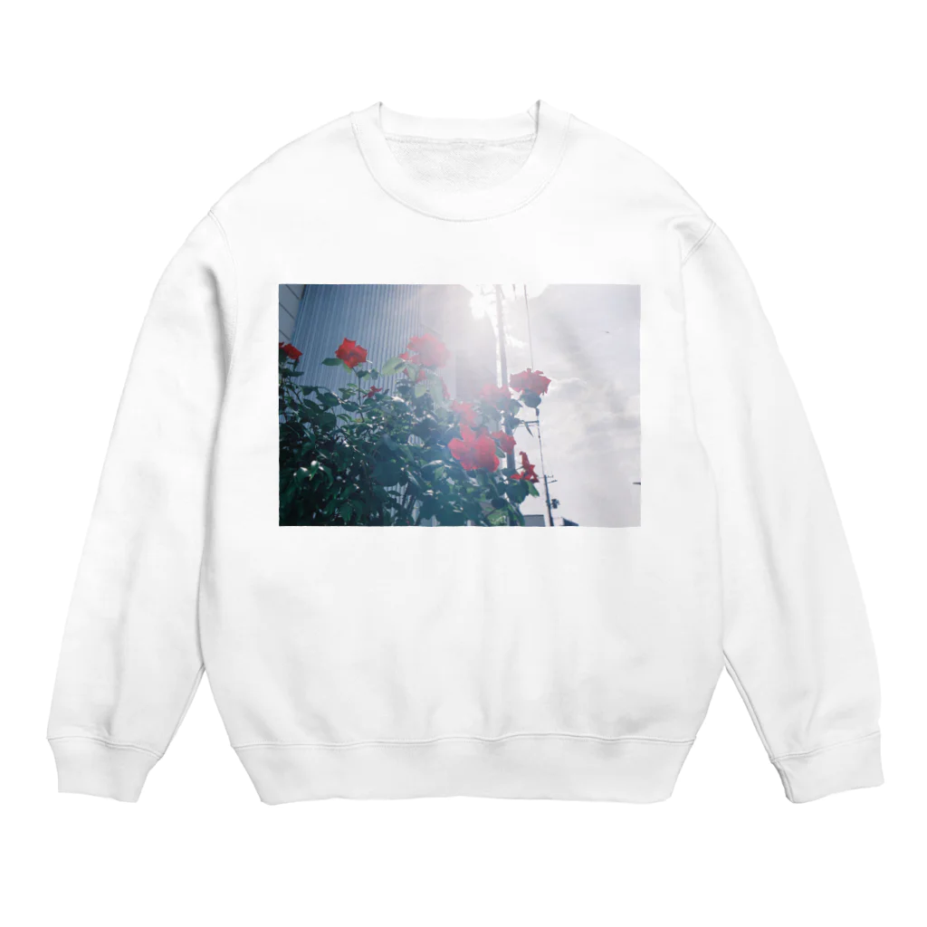 kio photo worksのFlower illuminated by sunlight Crew Neck Sweatshirt