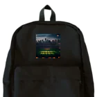 dream_canvasの空にそびえる高層ビルとスポーツスタジアムの壮大な景色。 Backpack