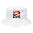 yunakiziの夕日の中シーガラスで遊ぶ子猫 Bucket Hat