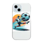 pothossysの夕日を背にサッカーボールを蹴りシュート Clear Smartphone Case