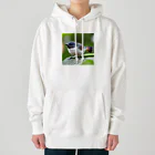 フリーダムのどこかを見つめている小鳥 Heavyweight Hoodie