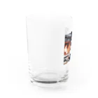 SWQAの暖炉の前でくつろぐ子ライオン Water Glass :left