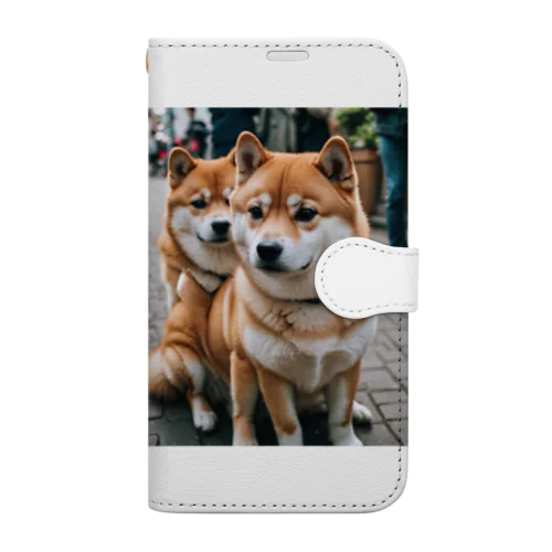 2匹のかわいい柴犬が仲良く並んで写っています。 Book-Style Smartphone Case