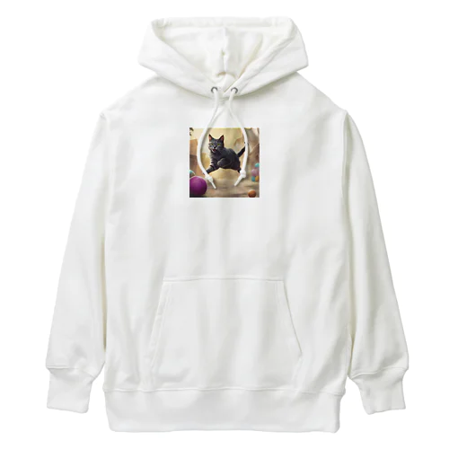 おもちゃを追いかけジャンプする猫ちゃん Heavyweight Hoodie