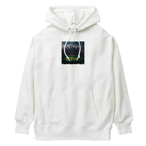 空にそびえる高層ビルとスポーツスタジアムの壮大な景色。 Heavyweight Hoodie