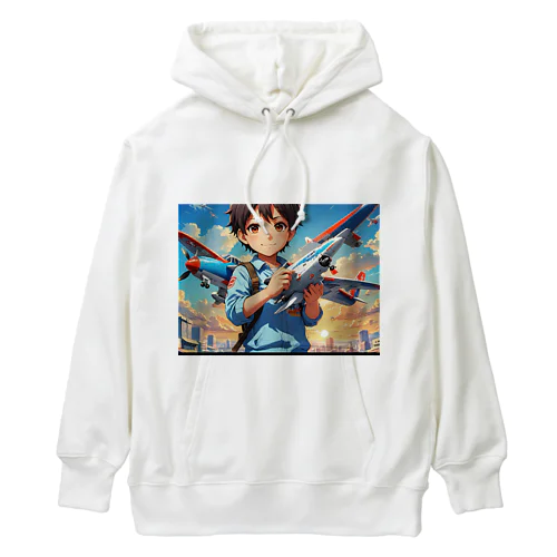 空を駆けるかっこいい飛行機模型を手にした子供 Heavyweight Hoodie