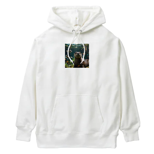 水中で気ままに泳ぐ愛らしいカワウソ Heavyweight Hoodie