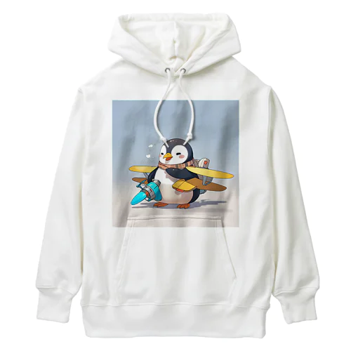 おもちゃの飛行機に乗ったかわいいペンギン Heavyweight Hoodie