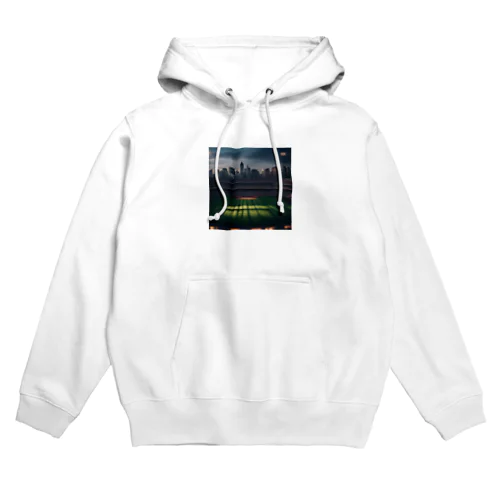 空にそびえる高層ビルとスポーツスタジアムの壮大な景色。 Hoodie