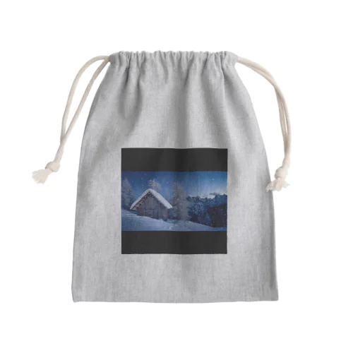 A snow-covered lodge  Mini Drawstring Bag