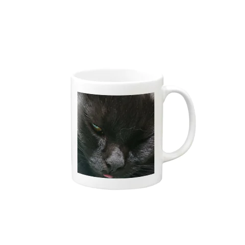 舌が出てる黒い猫 マグカップ