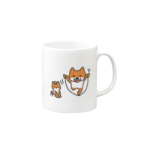 縄跳びをする犬と座っている犬 Mug