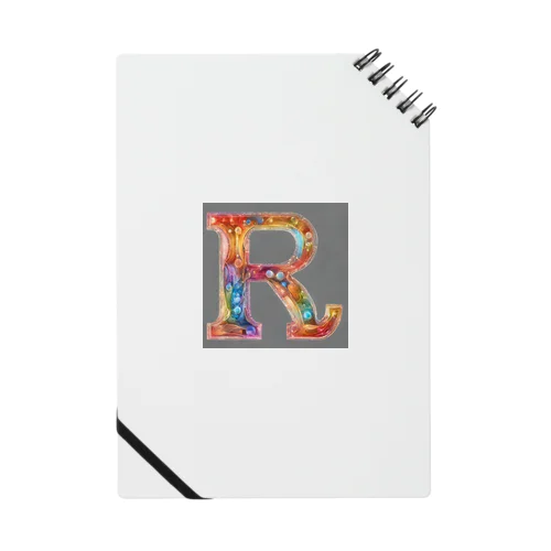 一文字のアルファベットが、美しく装飾されたデザインです Notebook