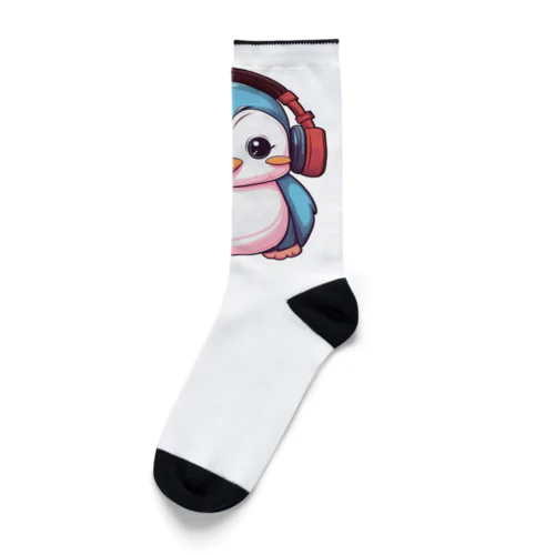 赤いヘッドホンを付けているペンギン Socks